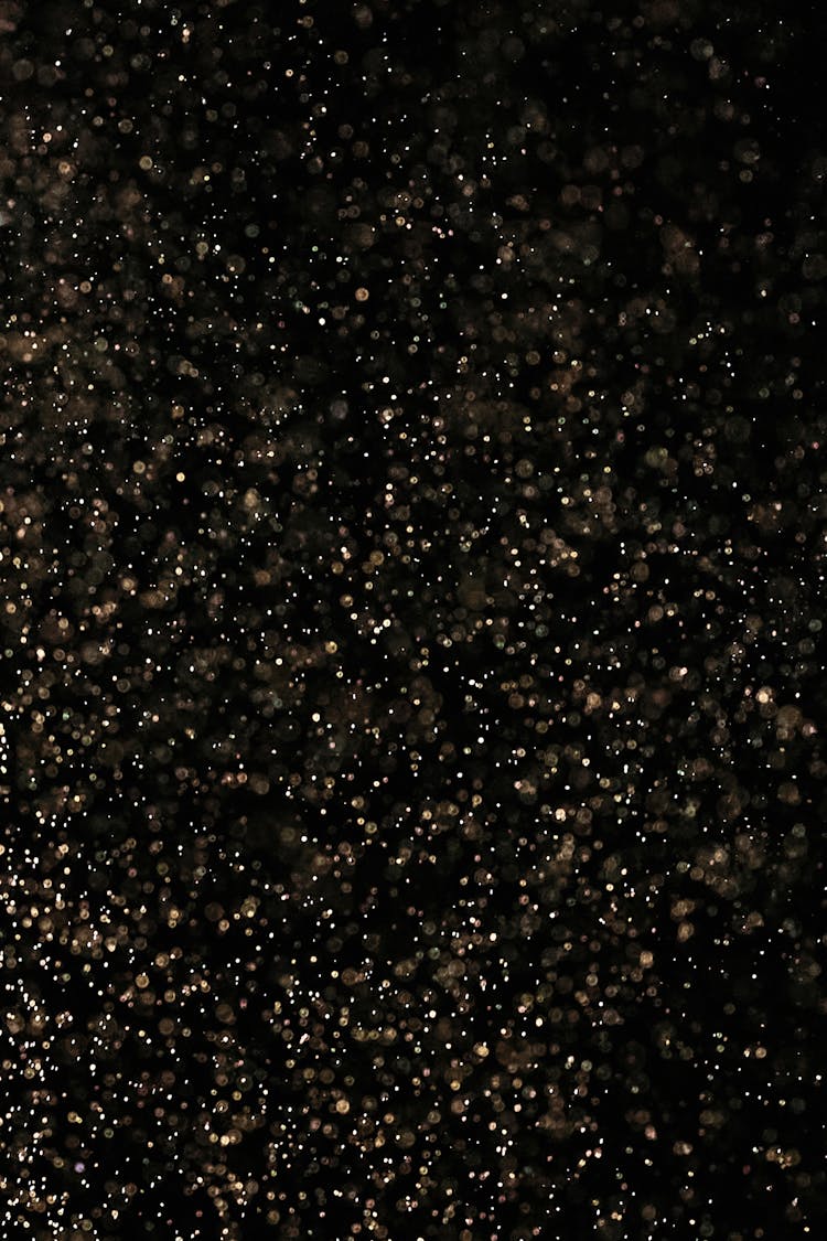 White Dust Particles On Black Background