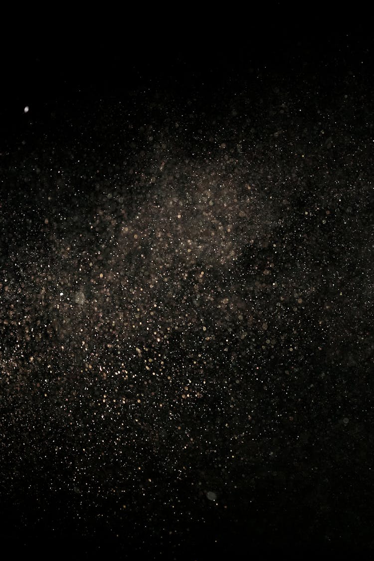 White Dust Particles On Black Background