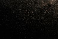 White Dust Particles on Black Background