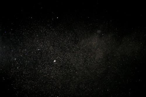 White dust and black background