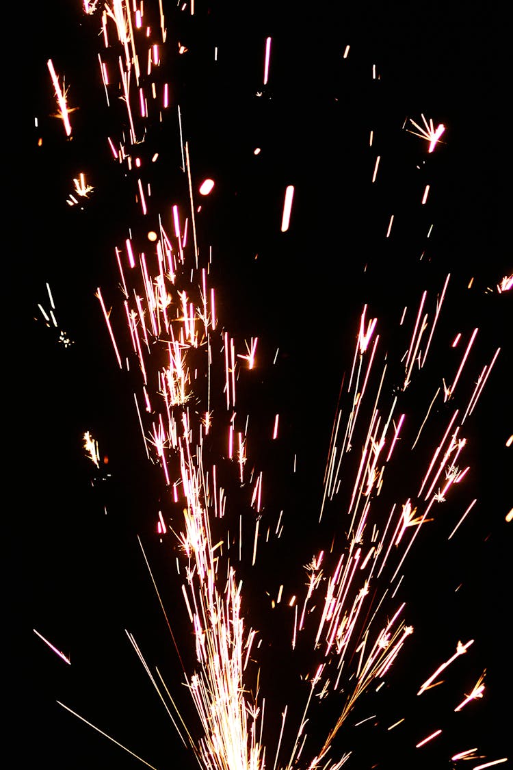 Flashing Sparks On Black Background