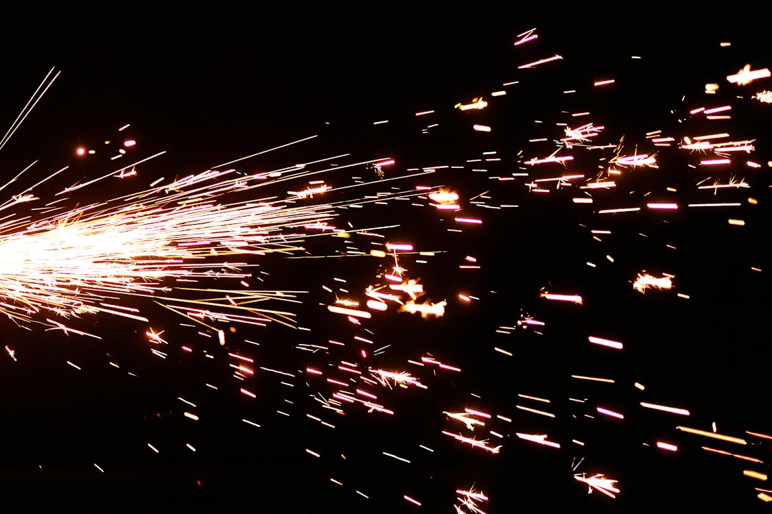 Close-Up Photo of Flashing Sparks on Black Background