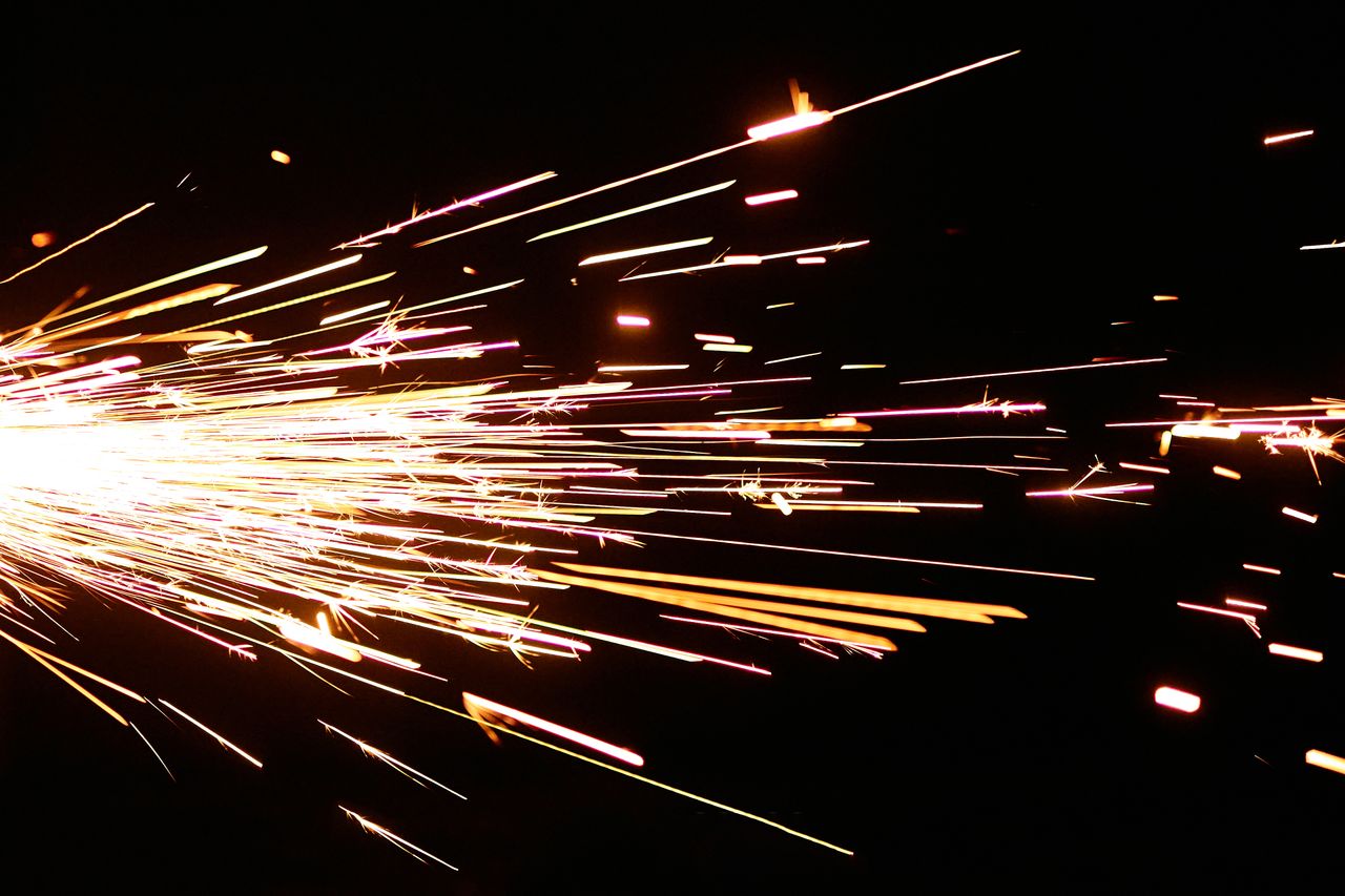 captivating sparks flying sideways on a black background showcasing mo