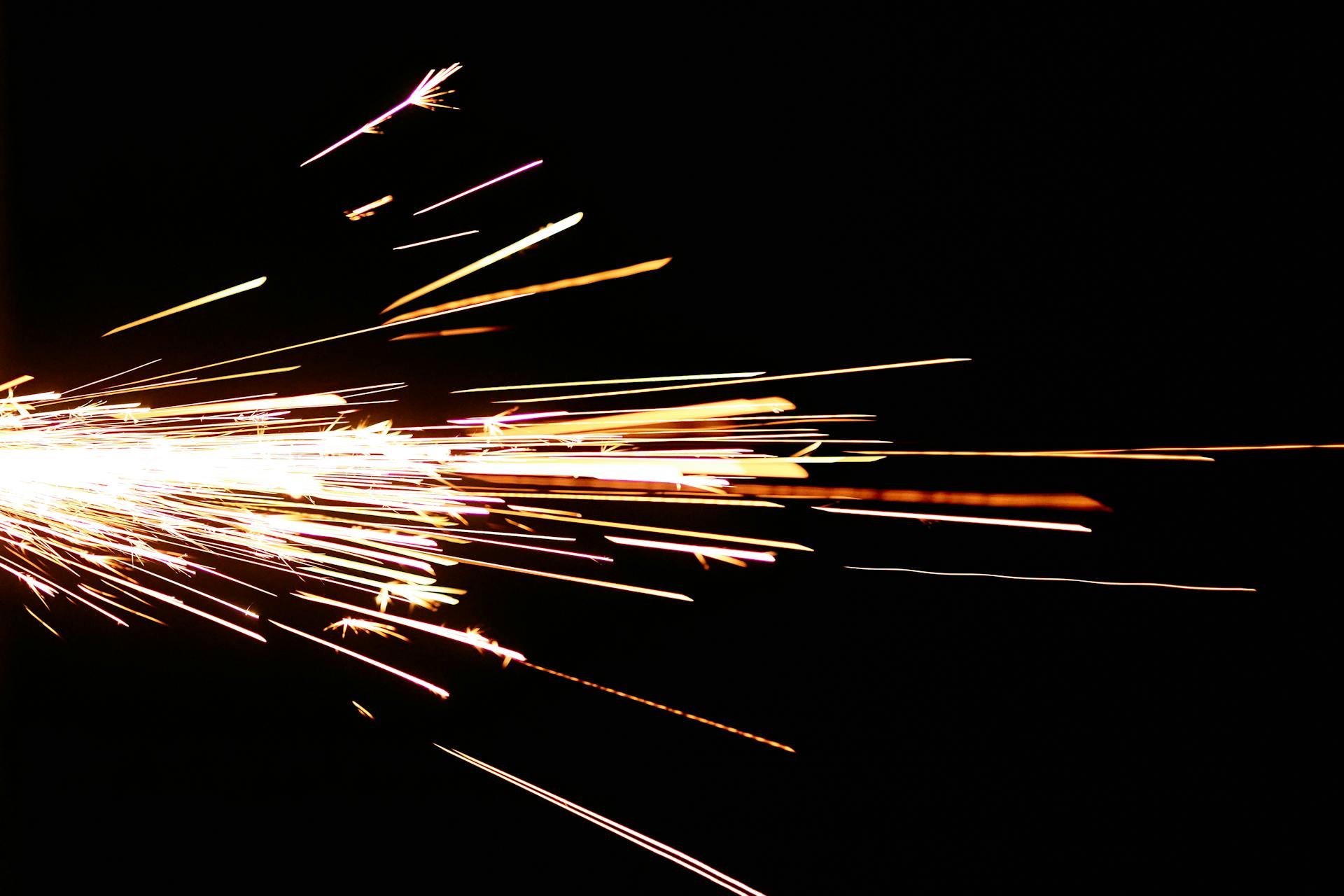 Close-Up Photo of Flashing Sparks on Black Background