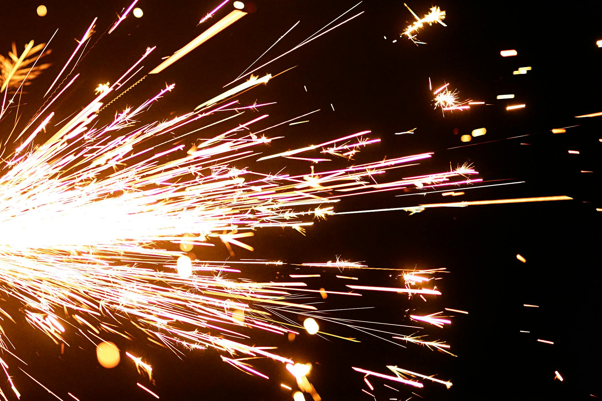 Close-Up Photo of Flashing Sparks on Black Background