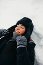 Adult woman laying down on snow