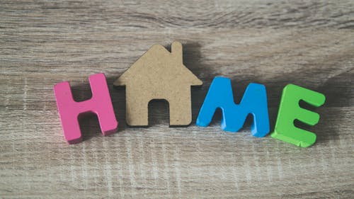 Colorful Word Home on Wood