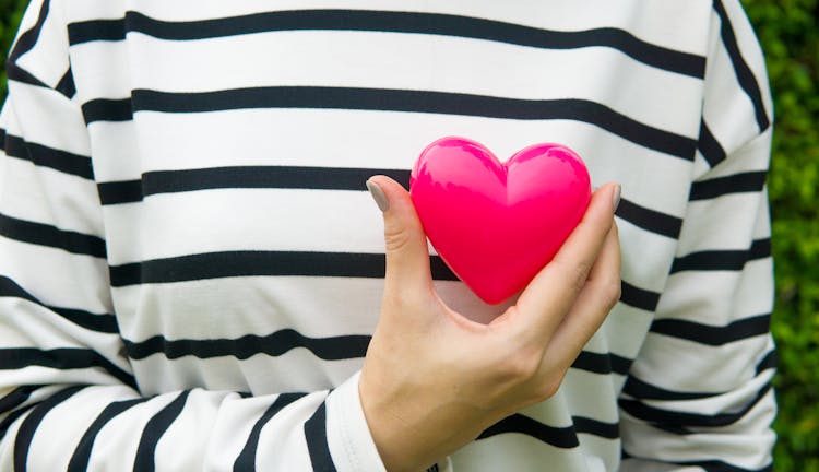 Woman Hand Holding Heart