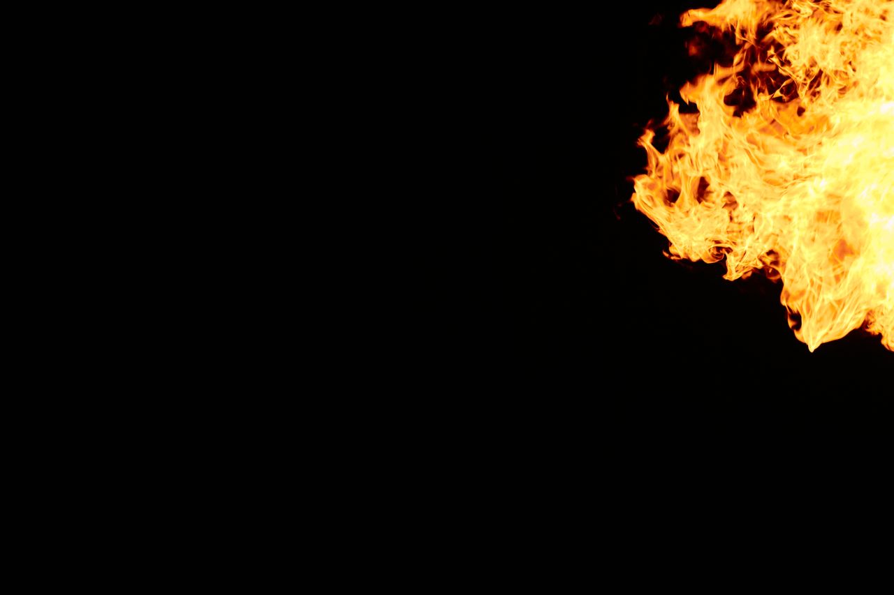 vivid flames against a black backdrop create an intense and dramatic e
