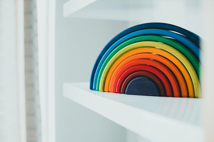 Wooden Rainbow Decoration On A Shelf 