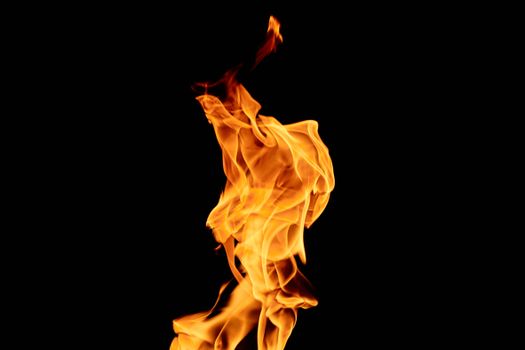 Close-up of a dynamic flame against a black background, highlighting textures and heat.
