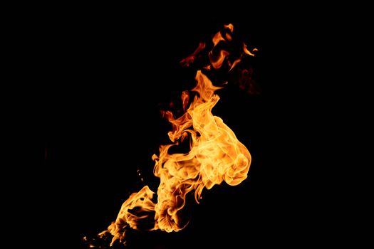 A vivid depiction of orange flames dancing against a dark backdrop, showcasing dynamic fire patterns.