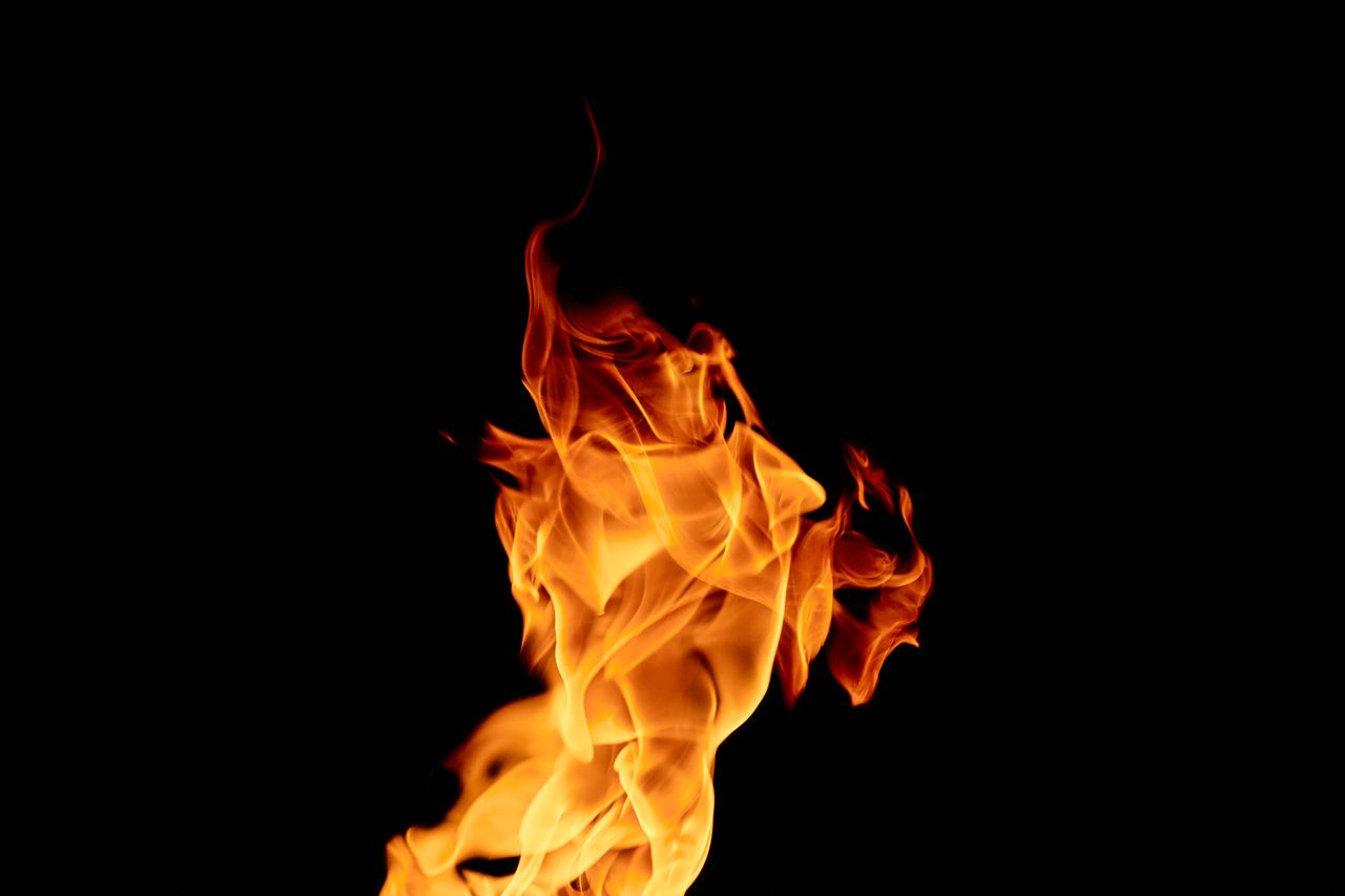 vibrant flames dancing against a black backdrop showcasing the natural