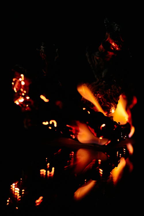 Fading flame on black background