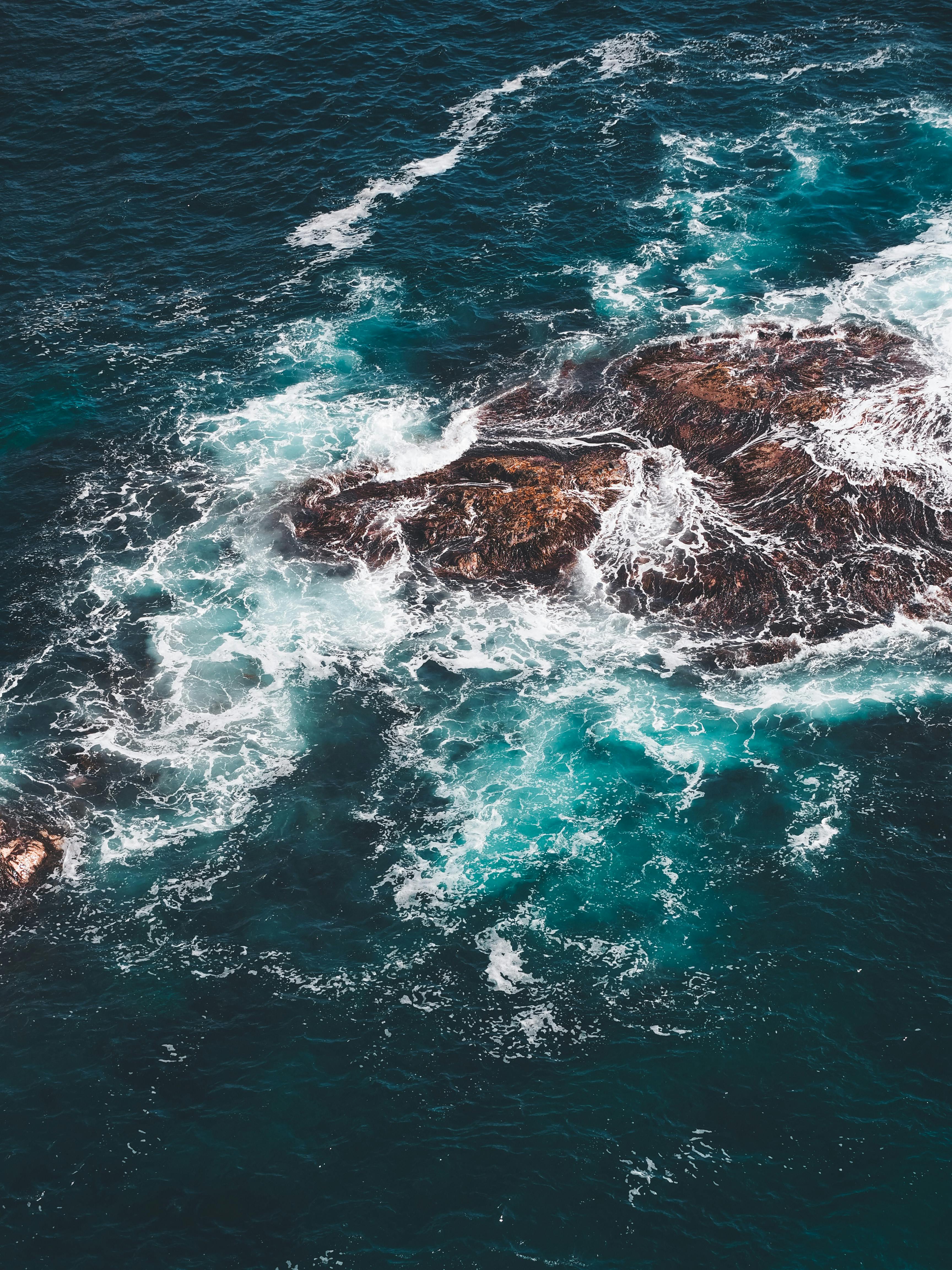 Aerial Shot Of Waves Crashing On White Sand Free Stock Photo