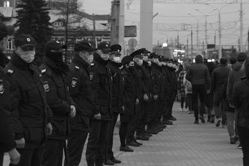 A Row of Policemen Wearing Face Mask
