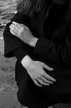 Woman in Black Dress Touching Her Tummy