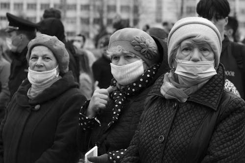 Grayscale Photo of Elderly Women Wearing Face Masks