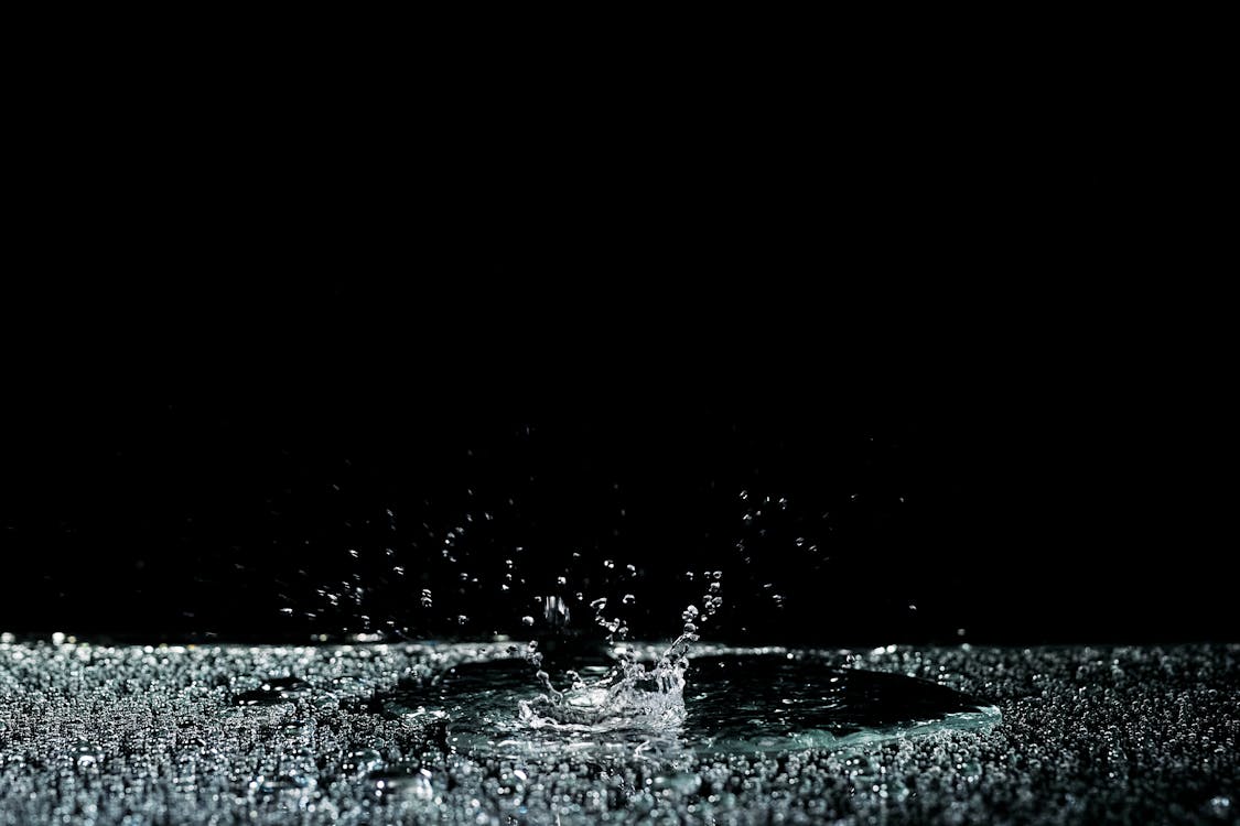 Water Splash Against Black Background