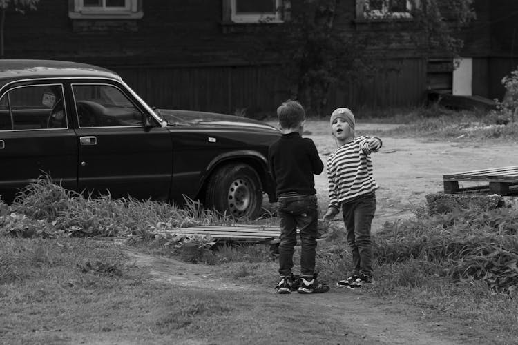 Black And White Photo Of Talking Boys