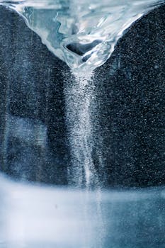 Close-up of a swirling water vortex, showcasing fluid dynamics and visual effects.