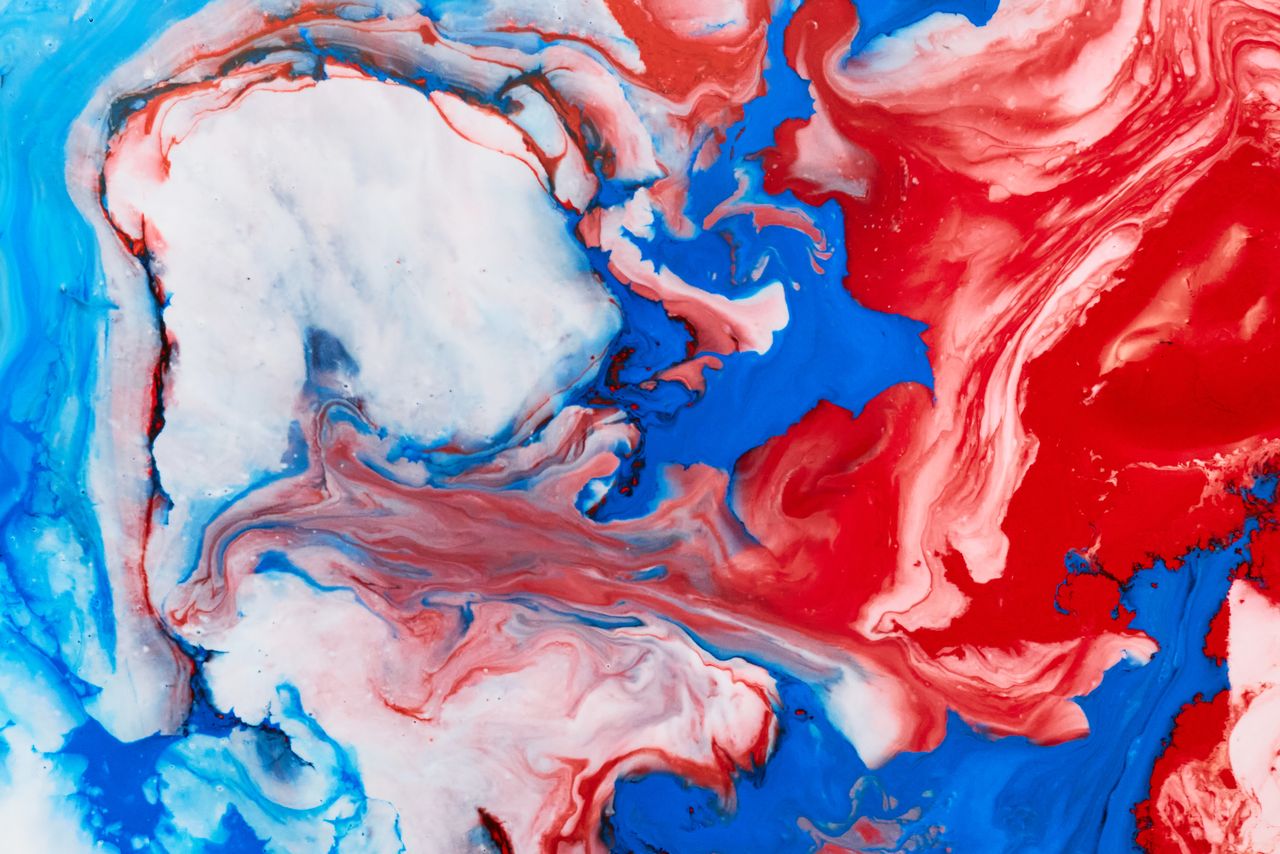 vibrant abstract artwork featuring swirling patterns of red blue and w