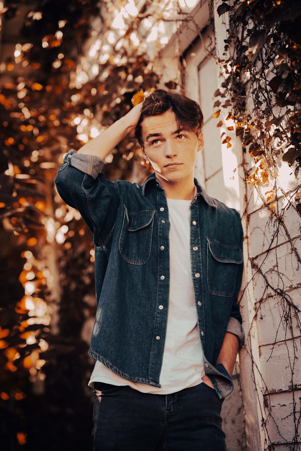 Man in Denim Jacket Leaning on a Wall · Free Stock Photo