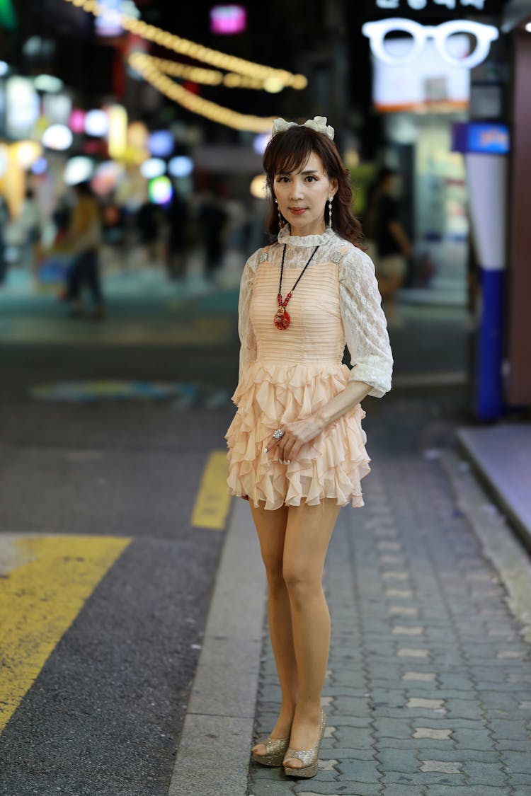 Woman Posing In City At Night