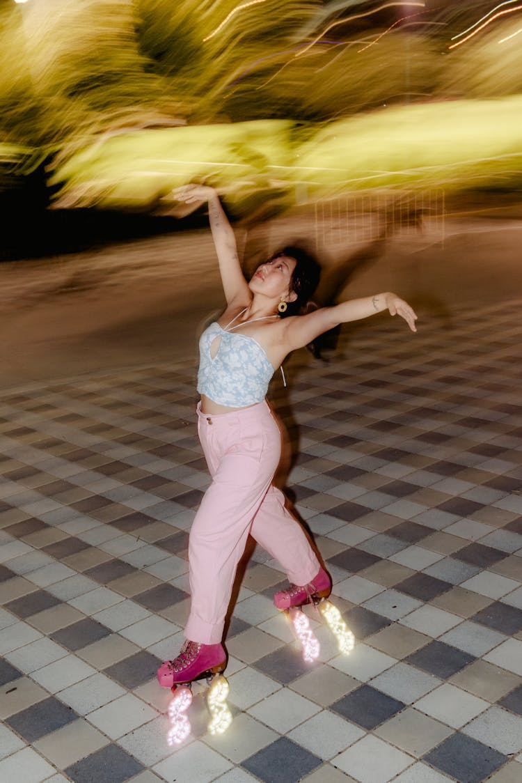 Woman Roller Skating At Night