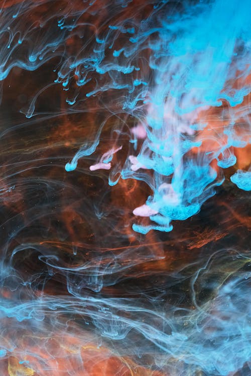 Hogesnelheidsfotografie Van Kleurrijke Inktdiffusie In Water