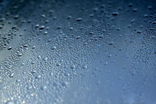 Close-up Photo of a Wet Glass Panel