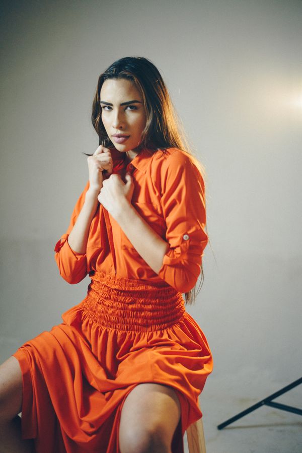 Woman in a smocked-waist floral midi dress