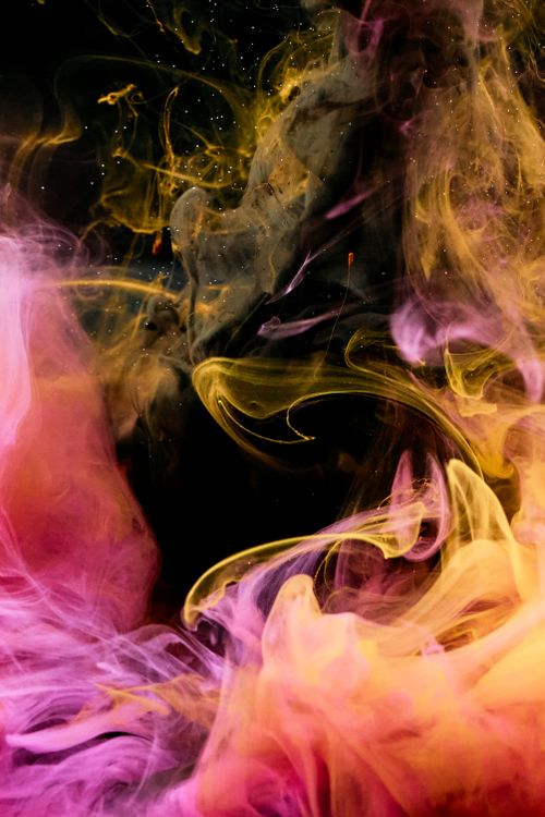 Free Abstract high-speed capture of swirling pink and yellow smoke with dynamic hues and textures. Stock Photo