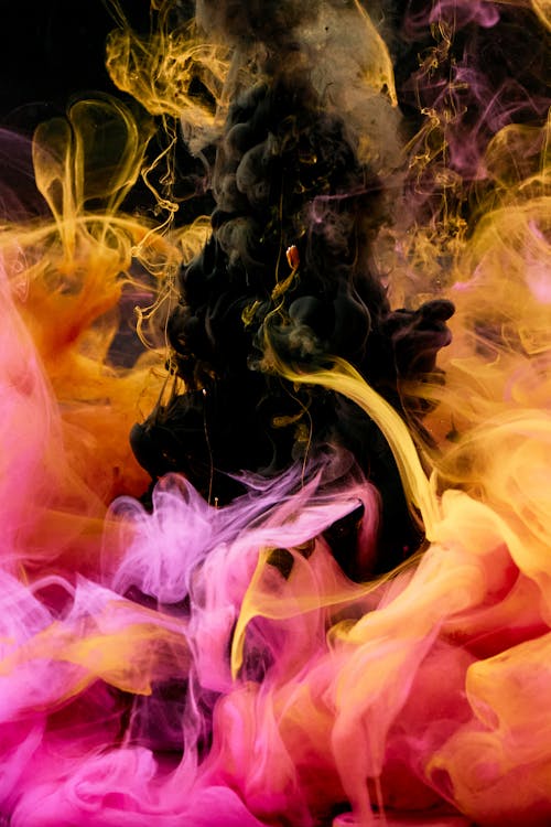 Free High-Speed Photography of Colorful Ink Diffusion in Water Stock Photo