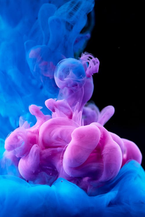 Photographie à Grande Vitesse De La Diffusion D'encre Colorée Dans L'eau
