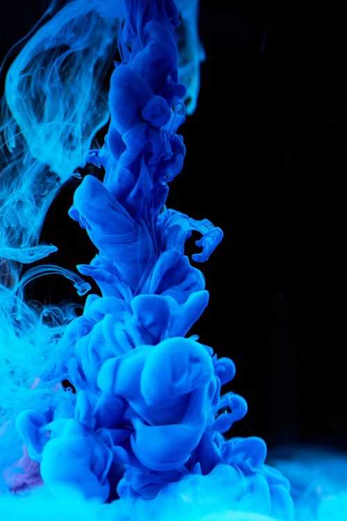 Free Abstract shot of blue ink swirling in water, showcasing vivid color diffusion. Stock Photo
