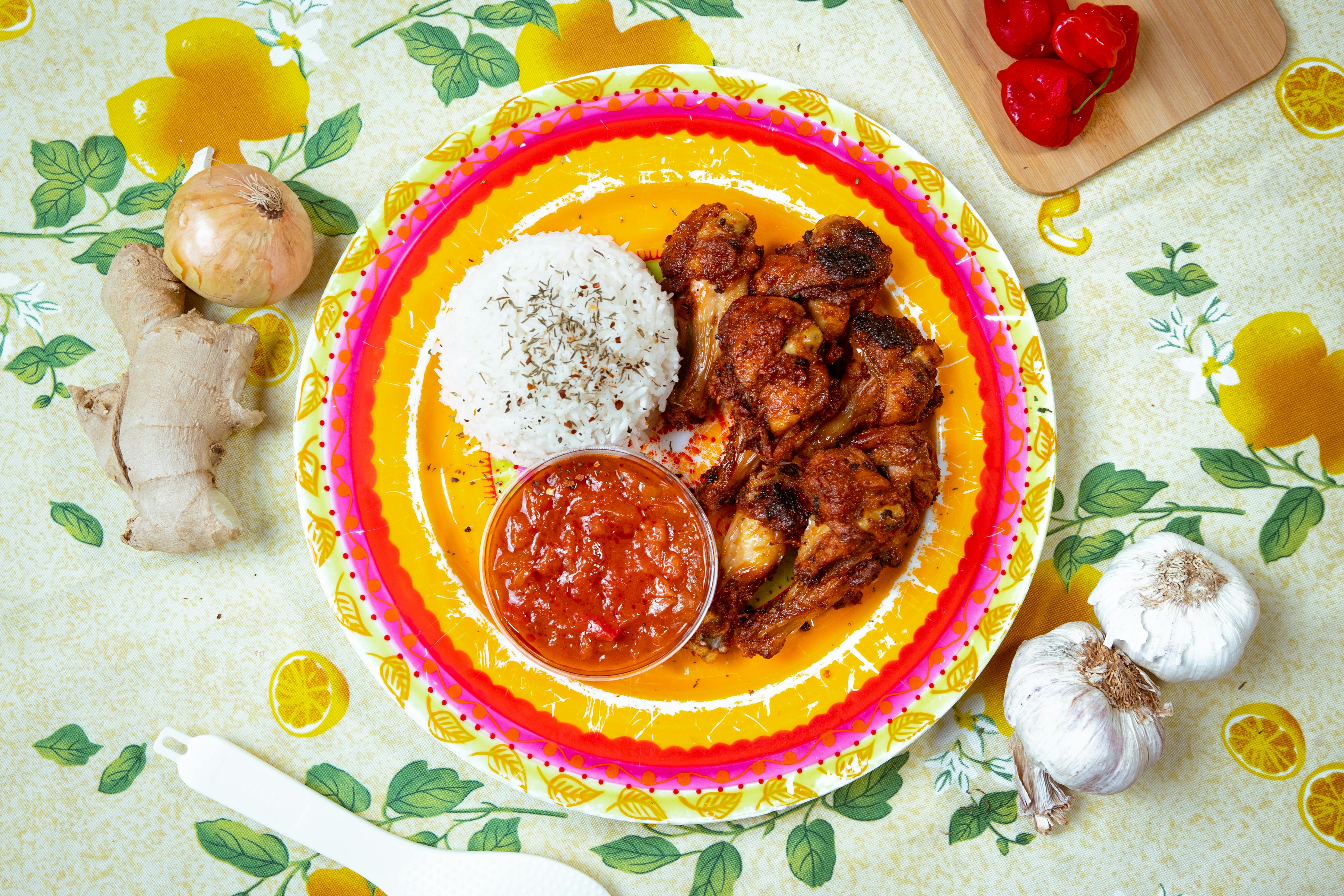 White Rice and Chicken with Sauce on Plate · Free Stock Photo