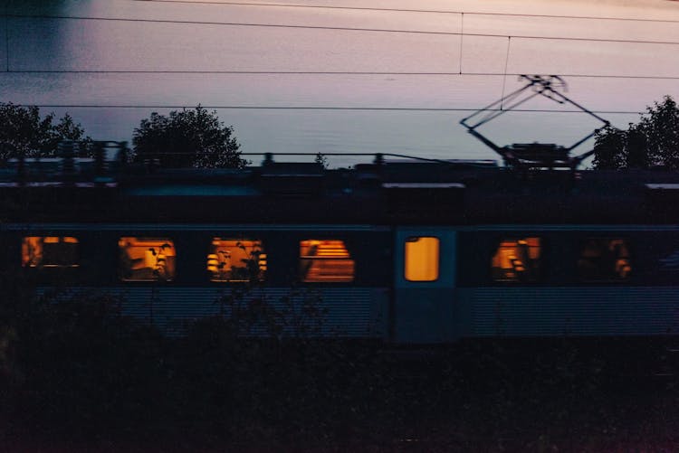 Train Driving By At Sunset