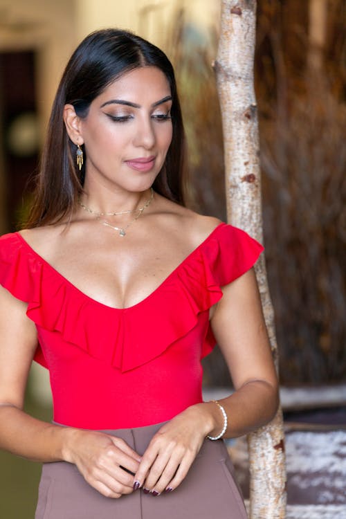 A Woman in Red Off Shoulder Dress