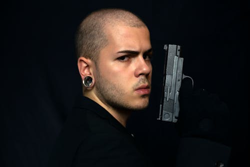 Free Man Holding a Gun Stock Photo