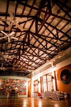 Stylish restaurant interior featuring armchairs and artistic wall decor.