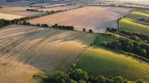 Free Expansive aerial view of sunny farmland in Central Bedfordshire, England. Stock Photo