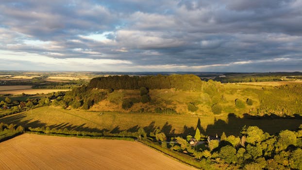 Drone capture of the lush rural landscape and rolling hills of Sharpenhoe, England.