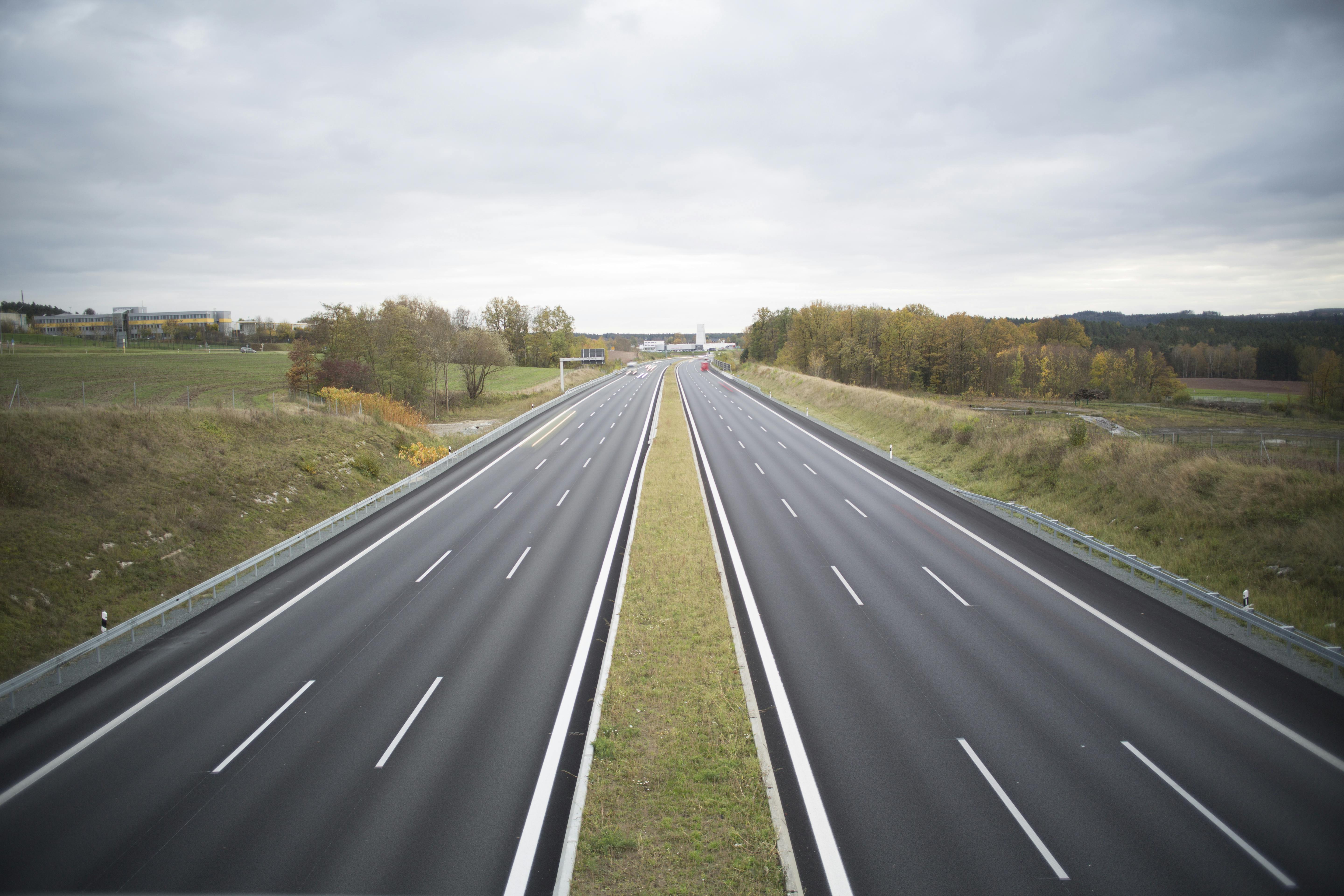 Two Grey Concrete Roads Between Green Grasses \u00b7 Free Stock Photo
