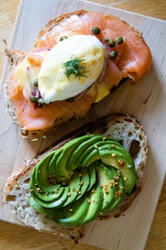 Savor gourmet avocado toast paired with smoked salmon and poached egg.
