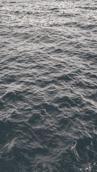 Captivating black and white photo of ocean waves showcasing the sea's dynamic motion and texture.