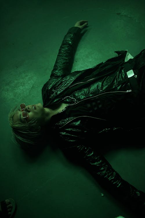 Free Man in Leather Jacket Lying on the Floor  Stock Photo
