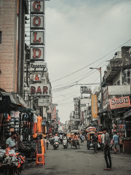 Busy market street scene in New Delhi, indicating local market context.