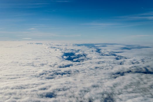 Scenic aerial shot of clouds over Dumfries and Galloway with blue sky.