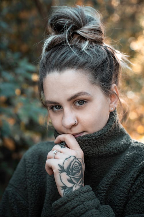 Free Close-Up Photo of a Woman with a Tattoo on Her Hand Stock Photo